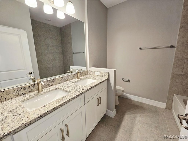 full bathroom featuring a sink, tile patterned flooring, toilet, and a tub