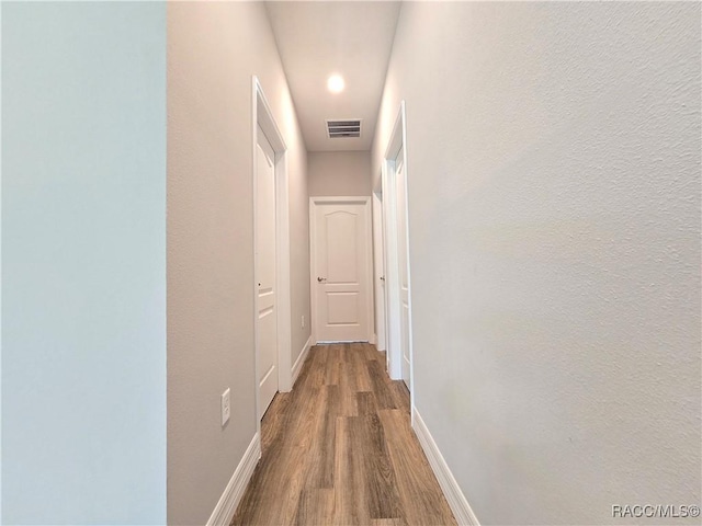 8 Calendula Ct, Homosassa, FL 34446 - corridor featuring wood finished floors and baseboards
