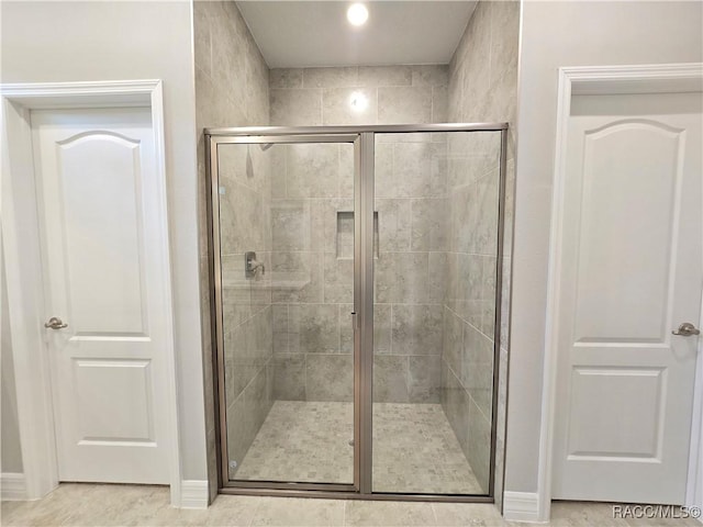 8 Calendula Ct, Homosassa, FL 34446 - bathroom featuring a shower stall and baseboards