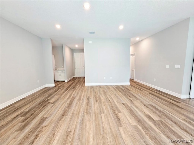 8 Calendula Ct, Homosassa, FL 34446 - empty room with light wood-style floors, recessed lighting, and baseboards