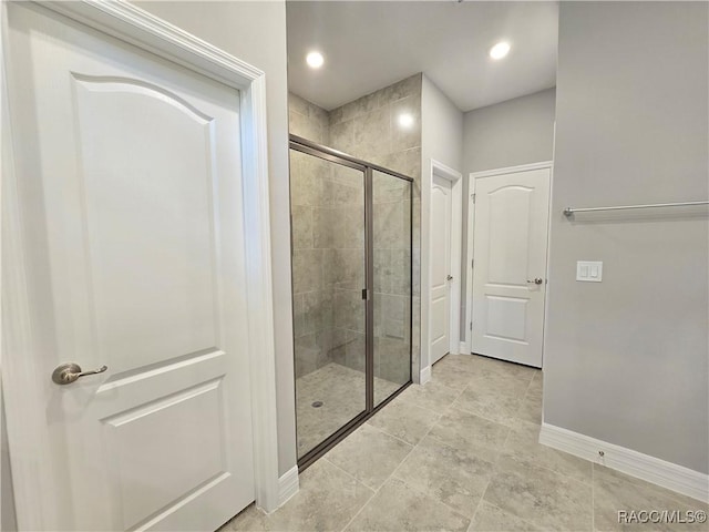 8 Calendula Ct, Homosassa, FL 34446 - bathroom with a shower stall and baseboards