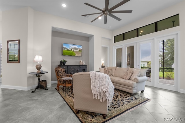 tiled living room with ceiling fan