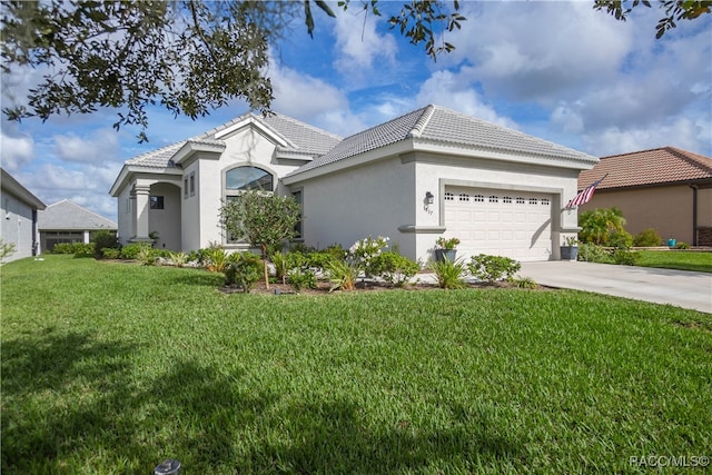 view of front of house featuring a front lawn and a garage