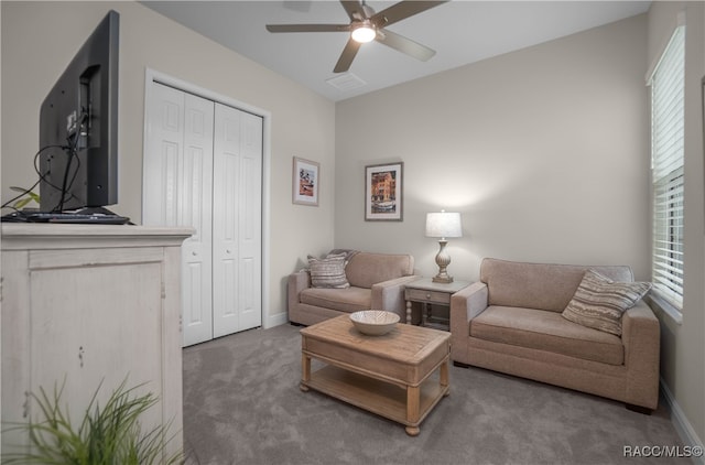 living room with ceiling fan and carpet floors