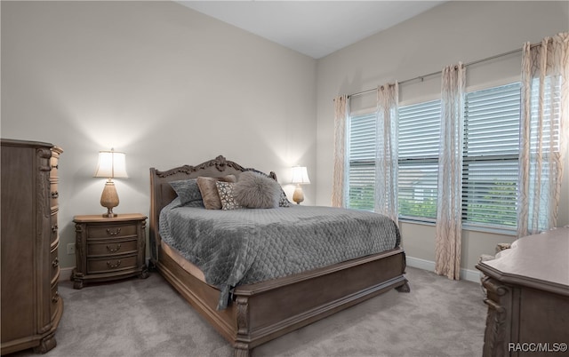 bedroom with light colored carpet