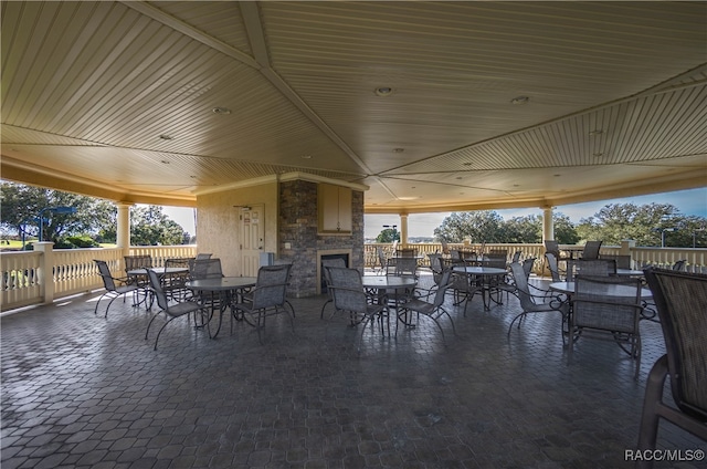 view of patio featuring an outdoor stone fireplace