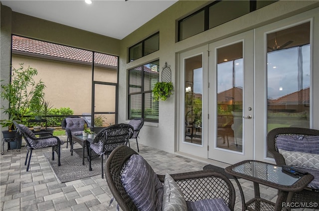 sunroom featuring french doors