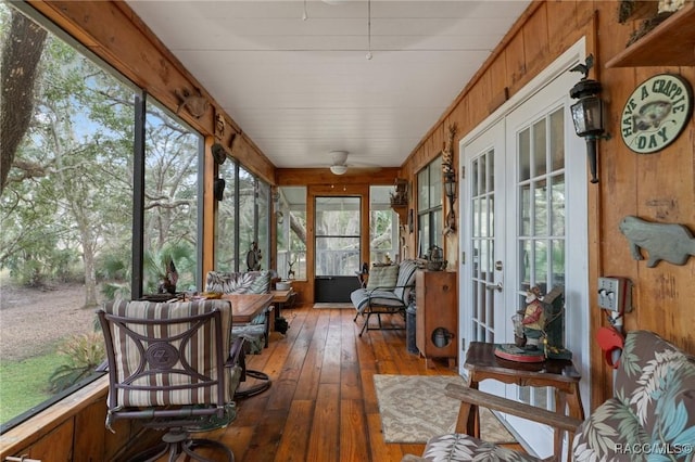 sunroom with french doors, plenty of natural light, and ceiling fan