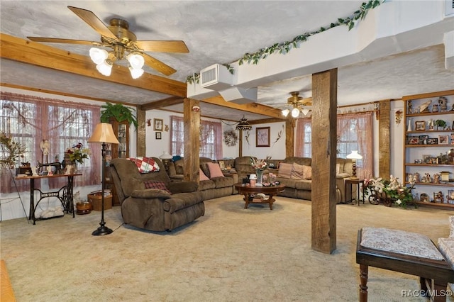 living room with ceiling fan, carpet floors, and a textured ceiling