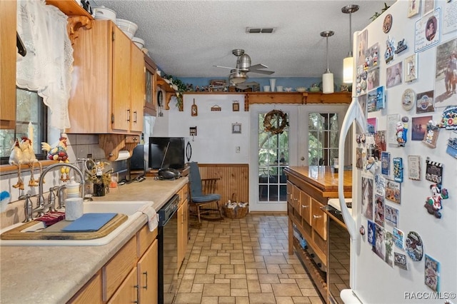 kitchen with french doors, white appliances, a textured ceiling, ceiling fan, and hanging light fixtures