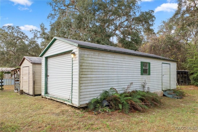 view of outdoor structure featuring a yard