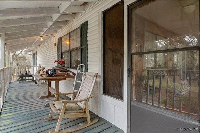 wooden deck featuring a porch