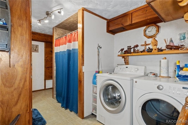 laundry room featuring washing machine and dryer