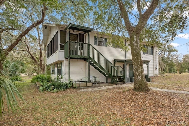 view of front of house featuring a sunroom