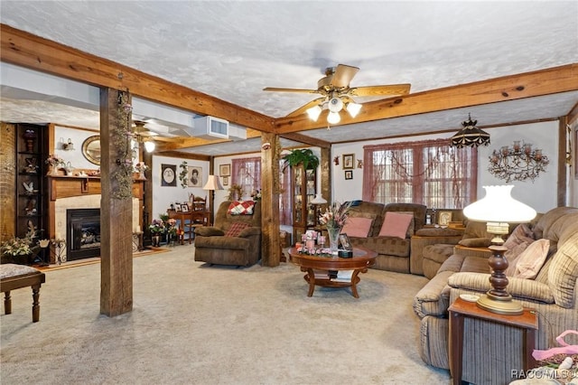 carpeted living room with ceiling fan, beamed ceiling, and a textured ceiling