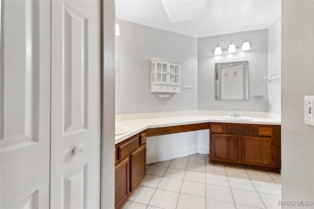 bathroom with tile patterned flooring and vanity