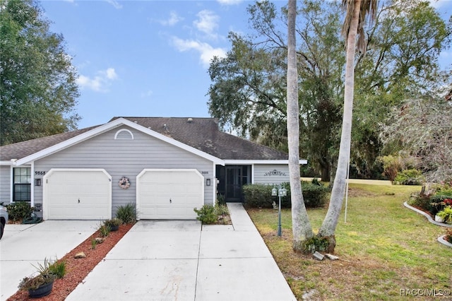 single story home with a garage and a front yard