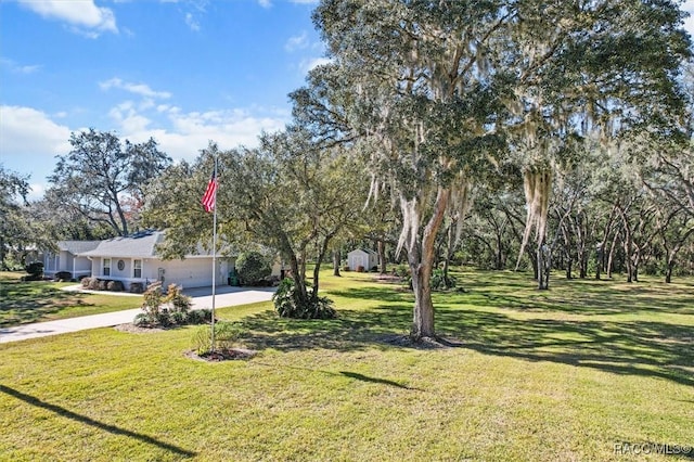 view of yard with a garage