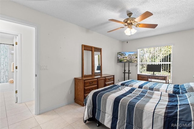 bedroom with ceiling fan, ensuite bathroom, and light tile patterned flooring