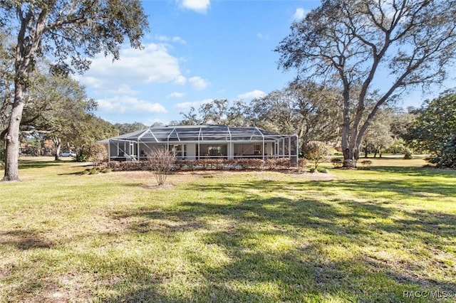 view of yard featuring a lanai