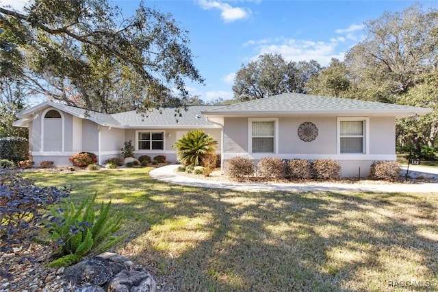 ranch-style home with a front yard