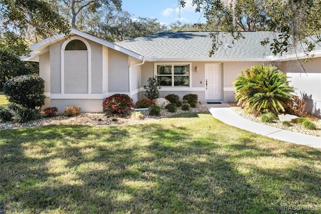 single story home with a front lawn