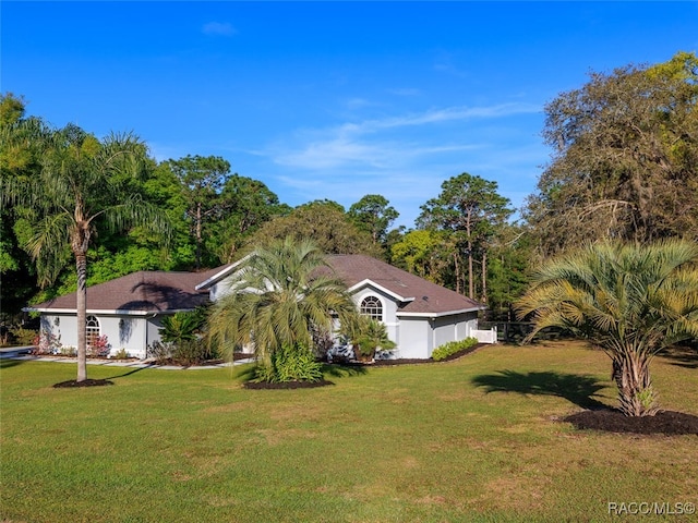 view of front of home with a front lawn