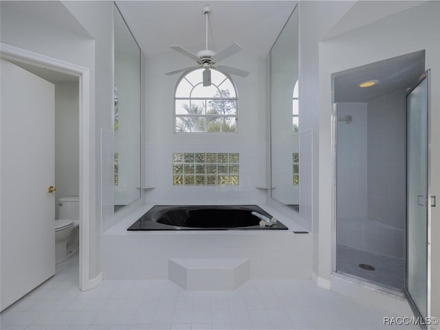 bathroom featuring plus walk in shower, tile patterned floors, toilet, and ceiling fan