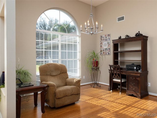 office featuring hardwood / wood-style floors and a notable chandelier