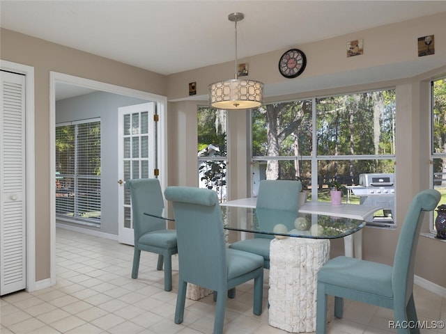 dining space featuring light tile patterned flooring