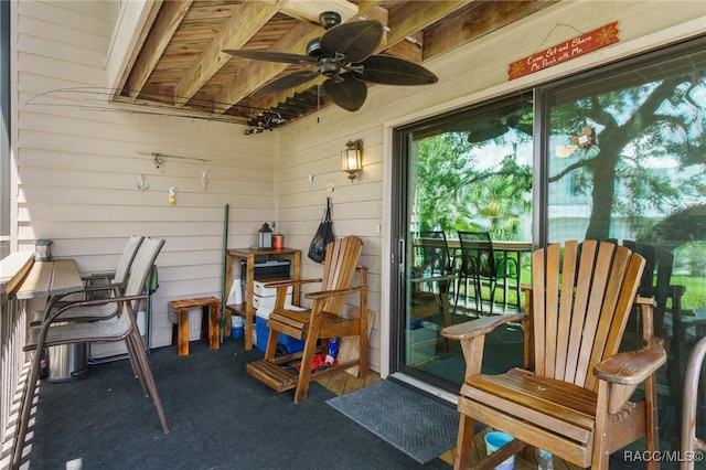 exterior space featuring ceiling fan