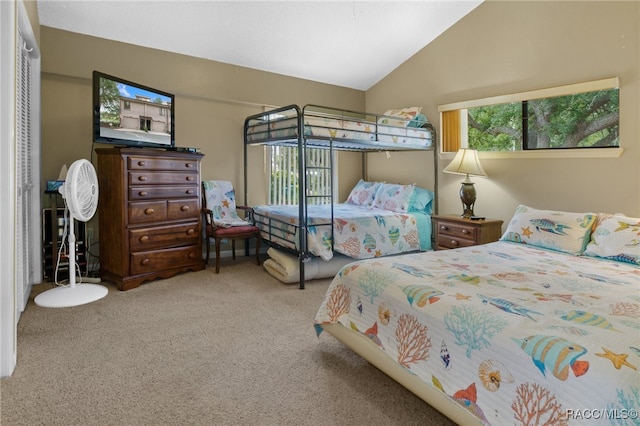 bedroom with light carpet and vaulted ceiling