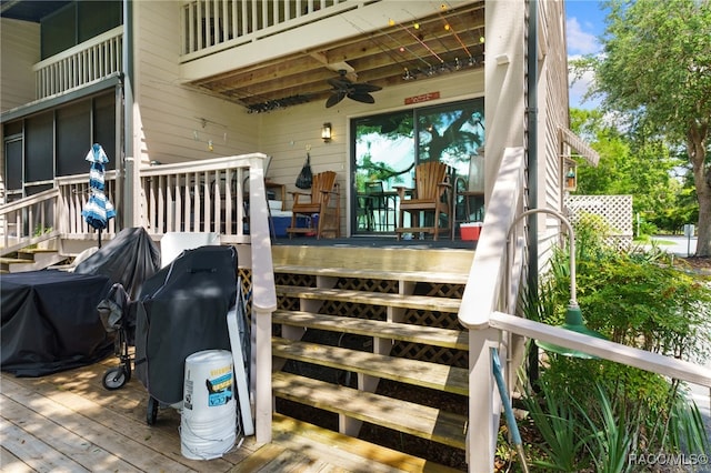 wooden deck featuring ceiling fan