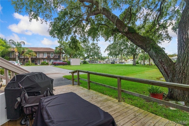 wooden deck with a yard