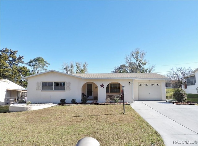 ranch-style house featuring a garage and a front yard