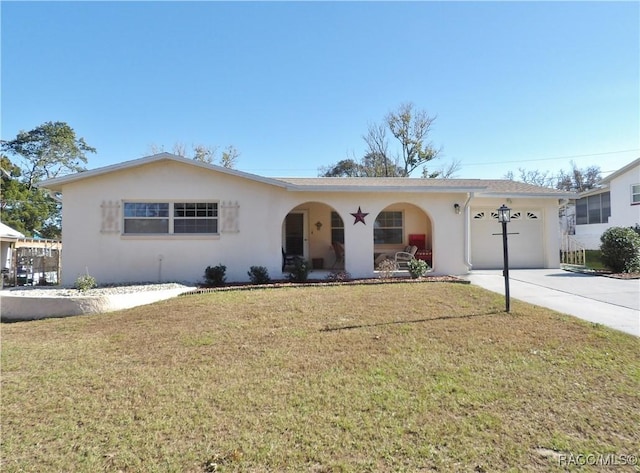 single story home featuring a front yard and a garage