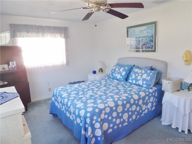 carpeted bedroom featuring ceiling fan