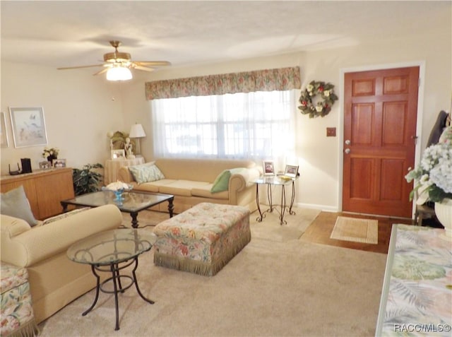 carpeted living room featuring ceiling fan