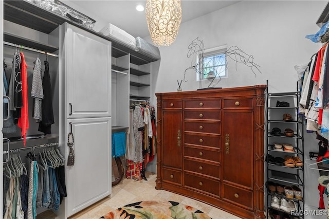 12380 SW 140th Loop, Dunnellon, FL 34432 - spacious closet featuring a chandelier