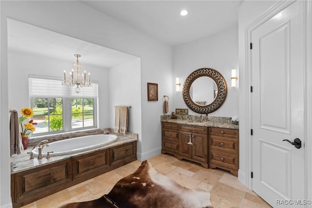 12380 SW 140th Loop, Dunnellon, FL 34432 - full bathroom with vanity, a garden tub, a chandelier, stone tile flooring, and recessed lighting