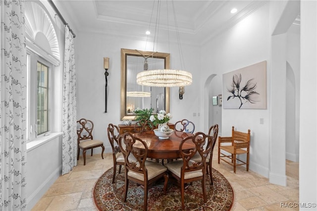 12380 SW 140th Loop, Dunnellon, FL 34432 - dining room with arched walkways, stone tile flooring, crown molding, baseboards, and recessed lighting