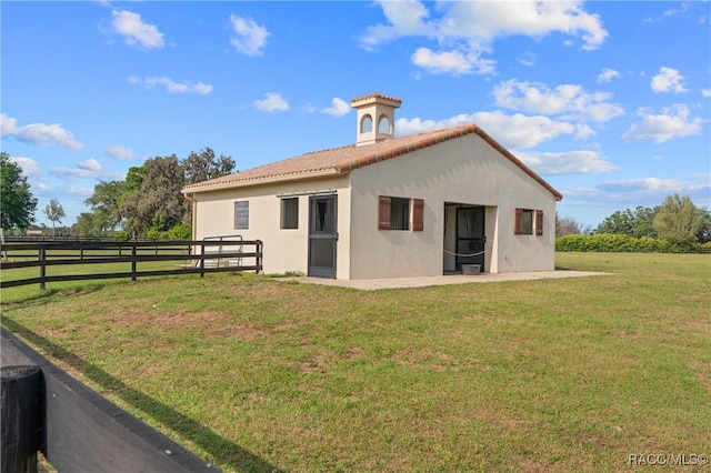 12380 SW 140th Loop, Dunnellon, FL 34432 - back of property with stucco siding, a tile roof, and a patio area