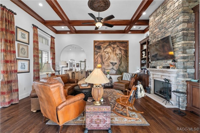 12380 SW 140th Loop, Dunnellon, FL 34432 - living room featuring a stone fireplace, hardwood / wood-style floors, beam ceiling, ceiling fan, and coffered ceiling