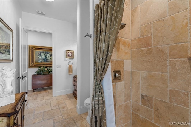 12380 SW 140th Loop, Dunnellon, FL 34432 - full bath featuring stone tile flooring, tiled shower, and baseboards