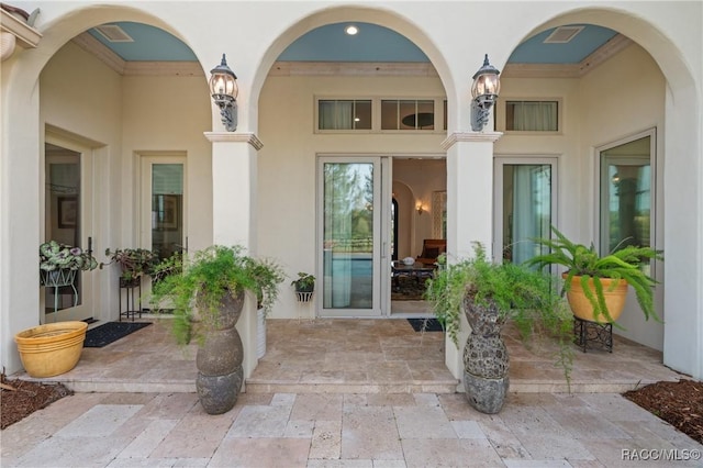 12380 SW 140th Loop, Dunnellon, FL 34432 - property entrance featuring stucco siding and a patio area