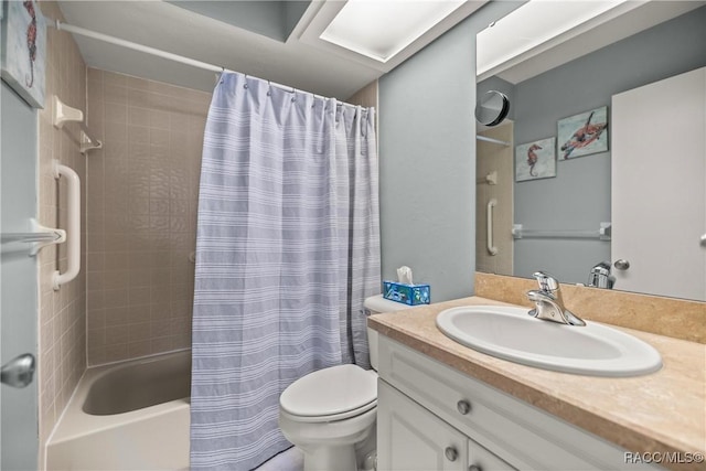 full bathroom with vanity, toilet, and shower / tub combo