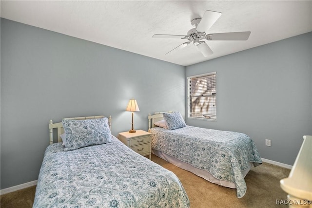 bedroom with ceiling fan and carpet floors