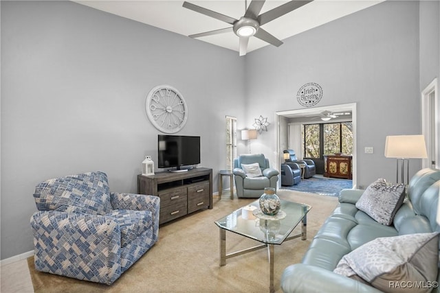 carpeted living room featuring ceiling fan