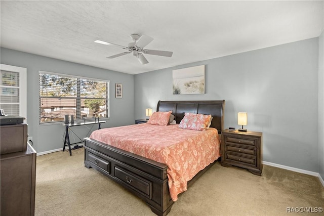 bedroom with light carpet and ceiling fan