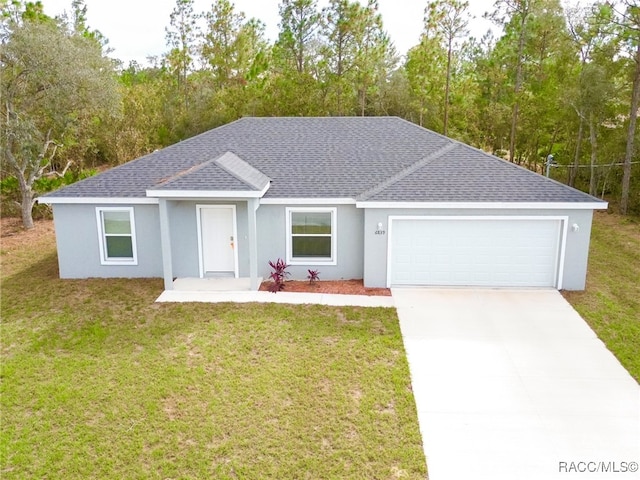 single story home with a garage and a front lawn